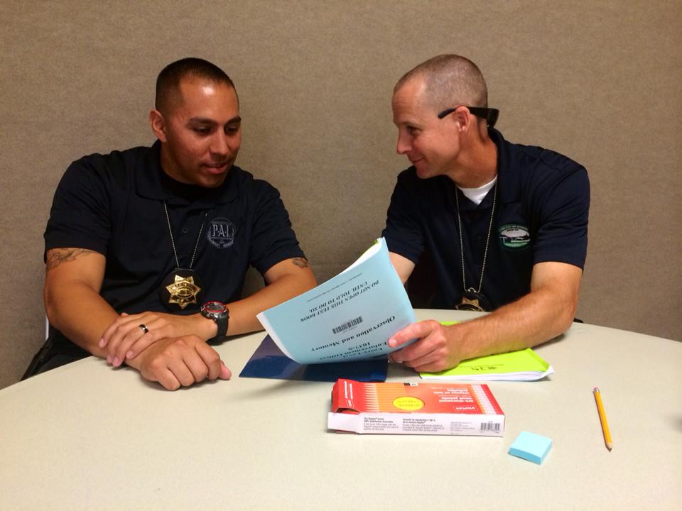 Two individuals reviewing documents